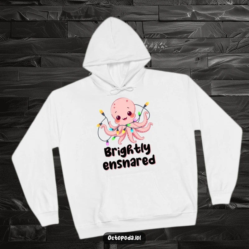 Funny hoodie with a playful octopus comically ensnared in a string of twinkling, colorful lights, exuding festive charm.